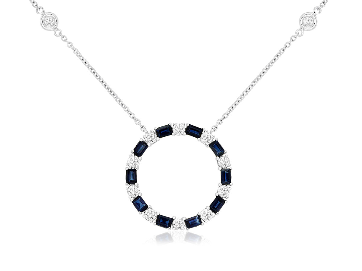 14K WHITE GOLD CIRCLE PENDANT WITH .62CTTW ROUND I1 CLARITY & HI COLOR DIAMONDS AND 1.20CTTW BAGUETTE SAPPHIRES ON A CABLE CHAIN WITH 4 BEZEL SET DIAMONDS
