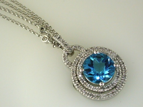 14K WHITE GOLD 2.80CT ROUND BLUE TOPAZ WITH .35CTTW ROUND I1 CLARITY & HI COLOR DIAMONDS SET IN THE DOUBLE HALO, BAIL AND IN THE DOUBLE CHAIN