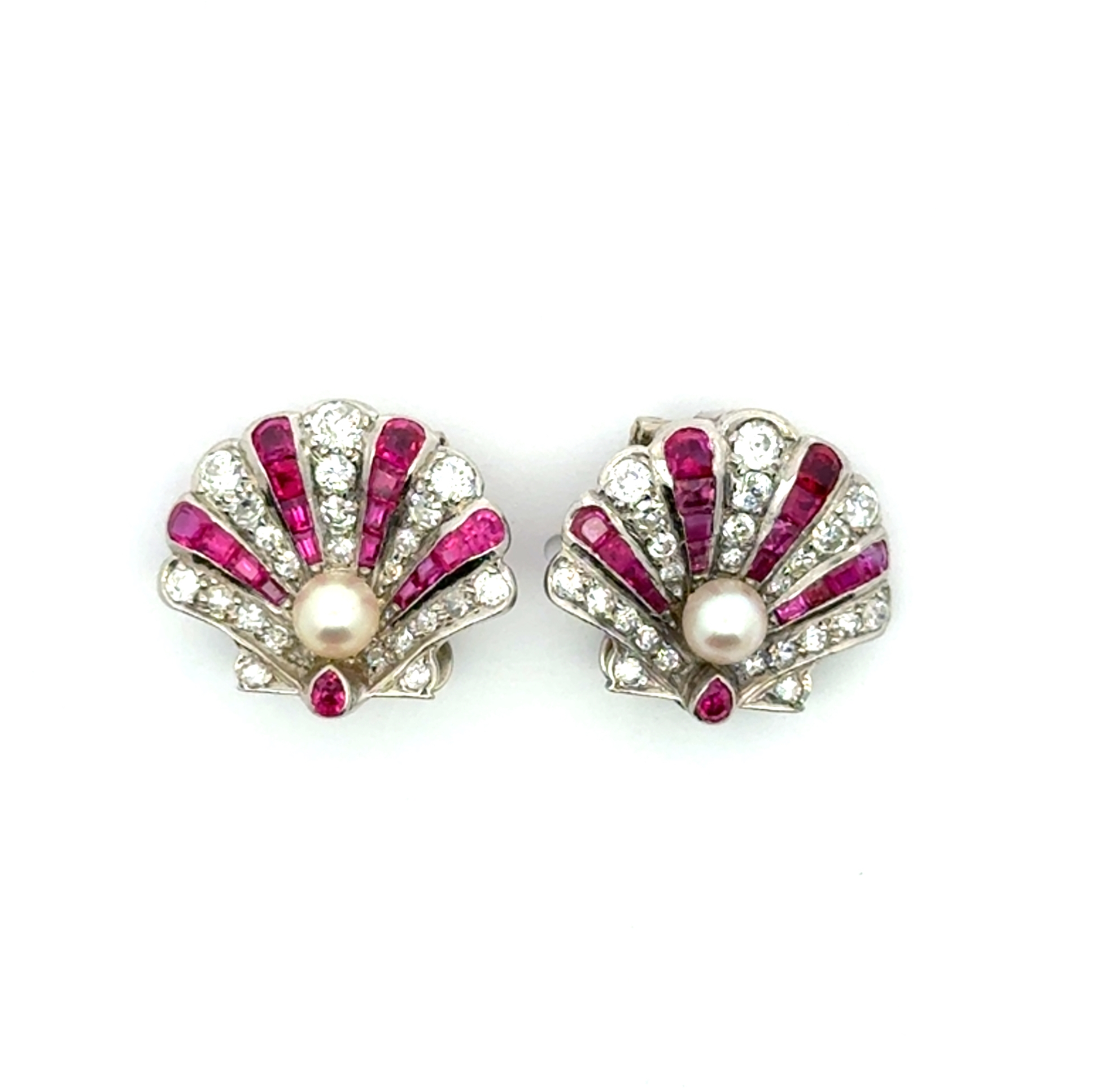 Platinum Art Deco Pearl Ruby and Diamond Clip Earrings with 2 Round Pearls 3.8mm and 32 Emerald Cut Rubies 1.28 CTW and 46 Round Diamonds 1.21 CTW
4.75dwt