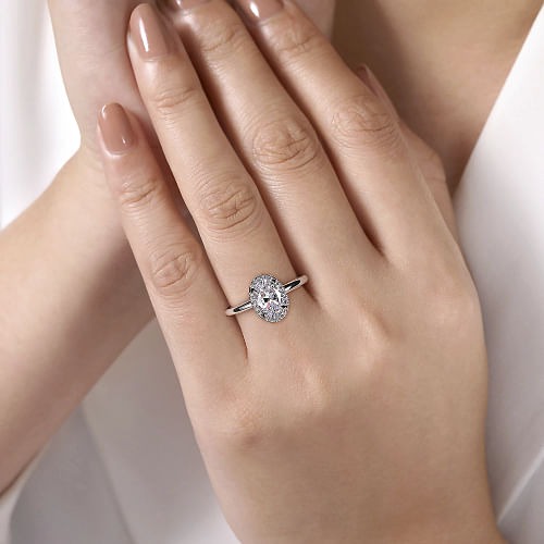 White and Rose Gold Oval Halo Diamond Engagement Ring l GABRIEL & CO.